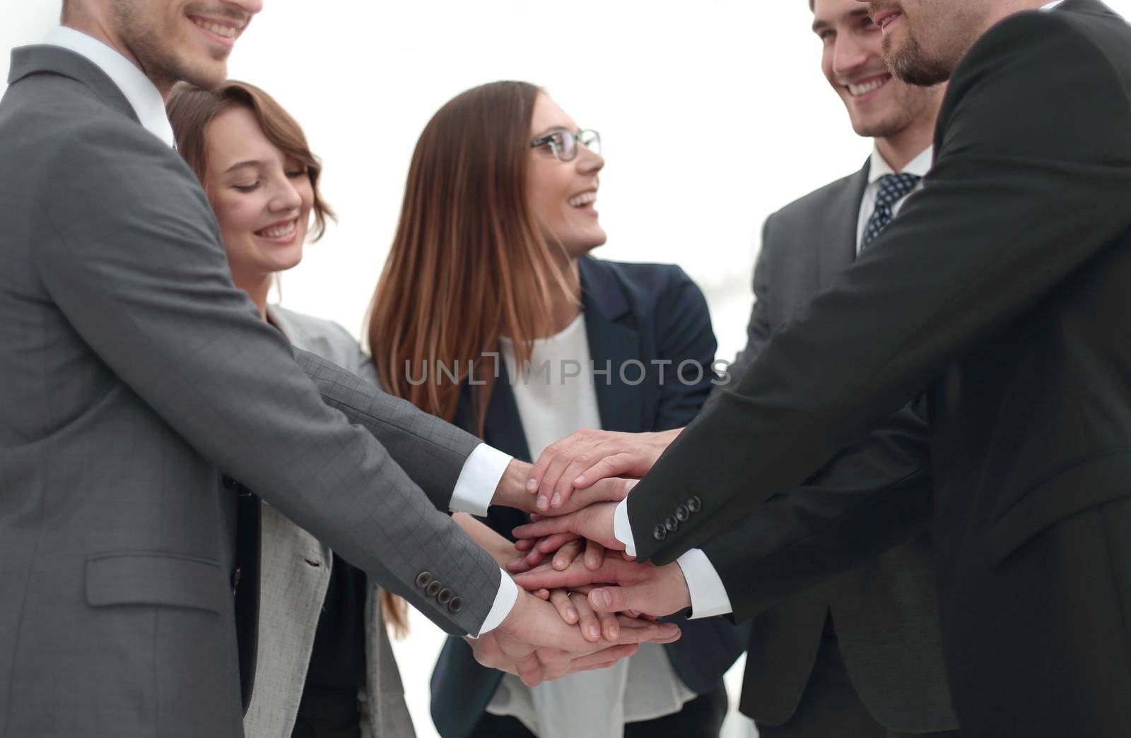 Close-up of people holding hands together while by asdf