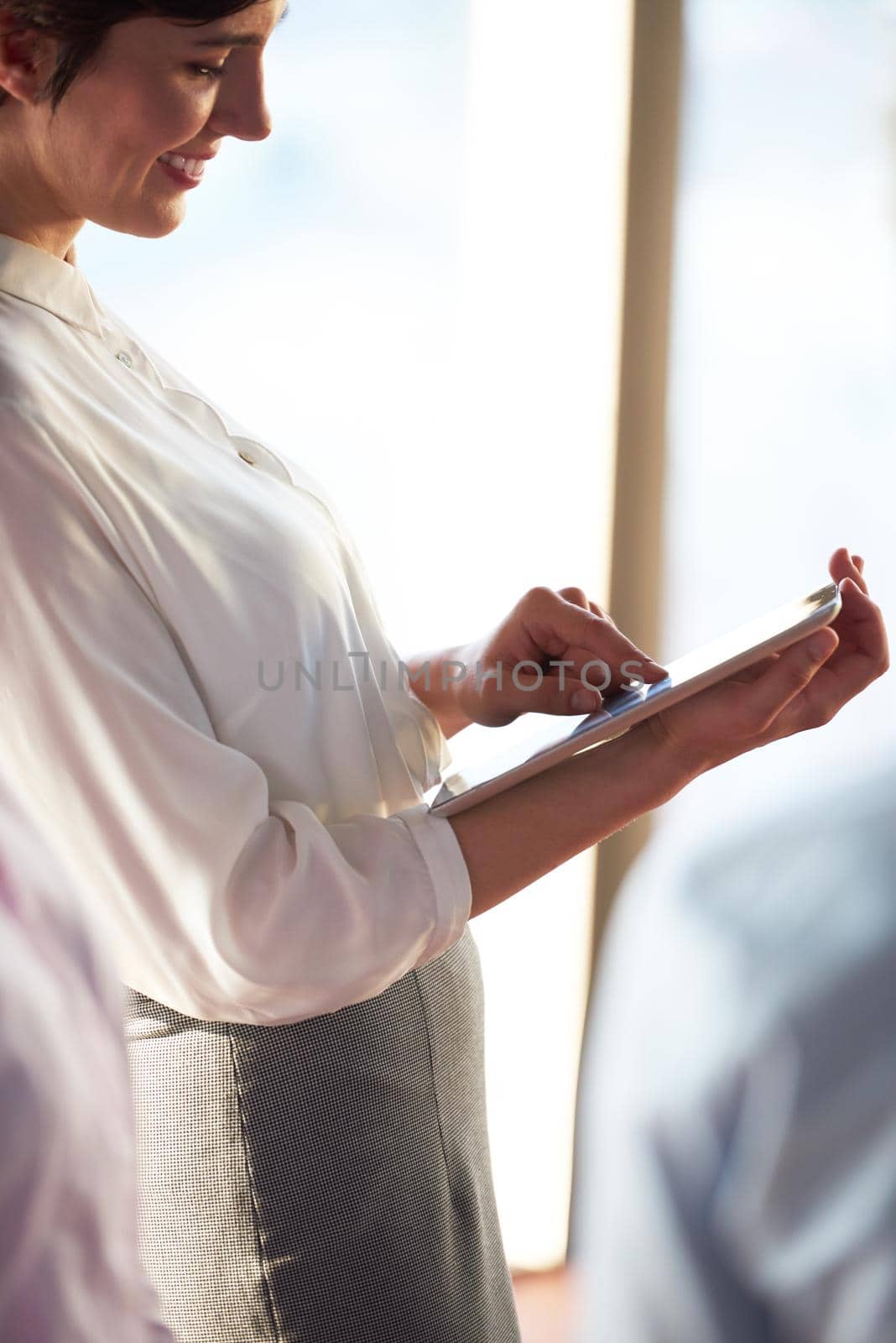 young business woman working on tablet computer at office