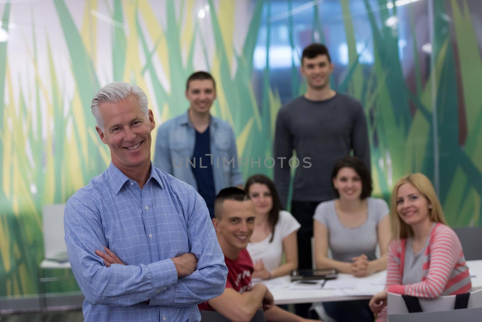 portrait of  teacher with students group in background by dotshock