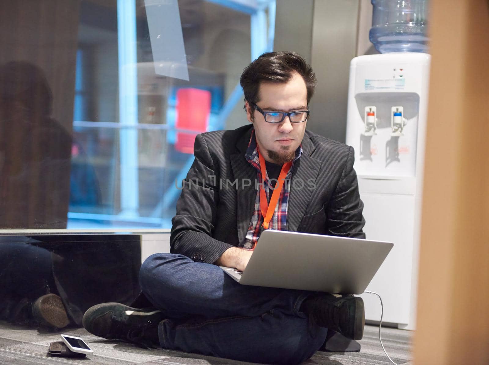 young business man in rush prepare conference presentation on laptop computer in startup company office interior