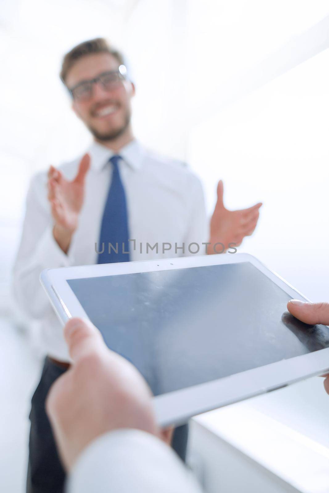 close up.businessman with digital tablet on office background by asdf