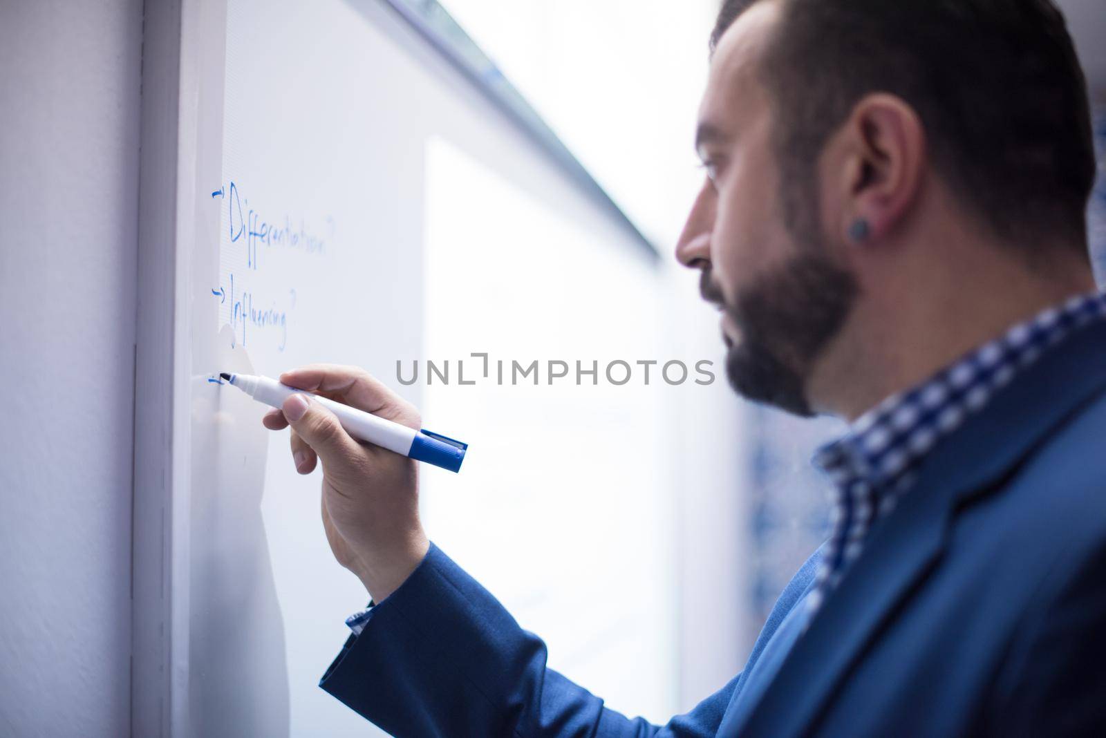 successful businessman giving presentations at conference room by dotshock