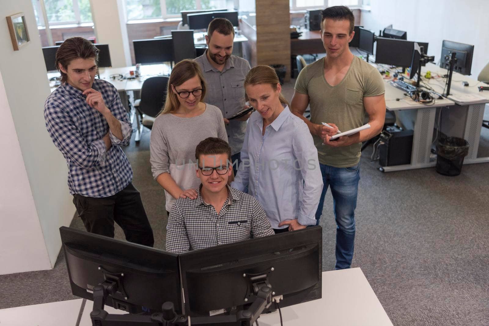 group of young startup business people standing as team by dotshock