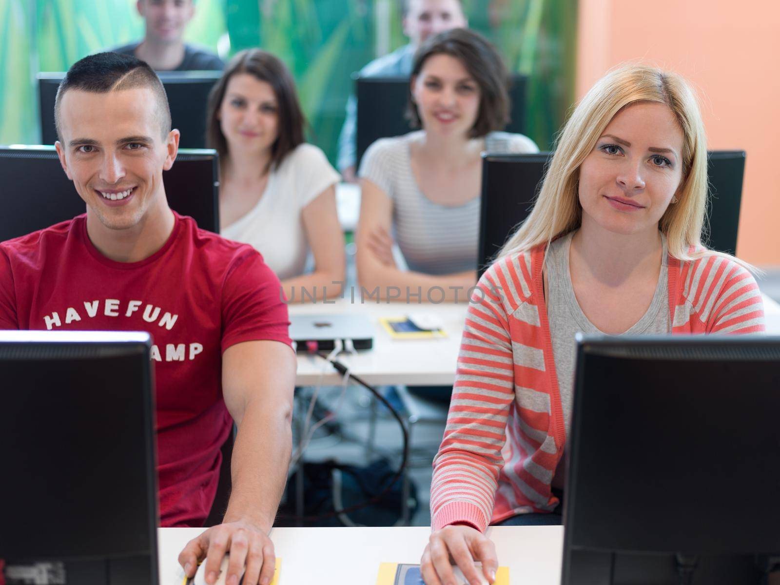 technology students group in computer lab school  classroom working on