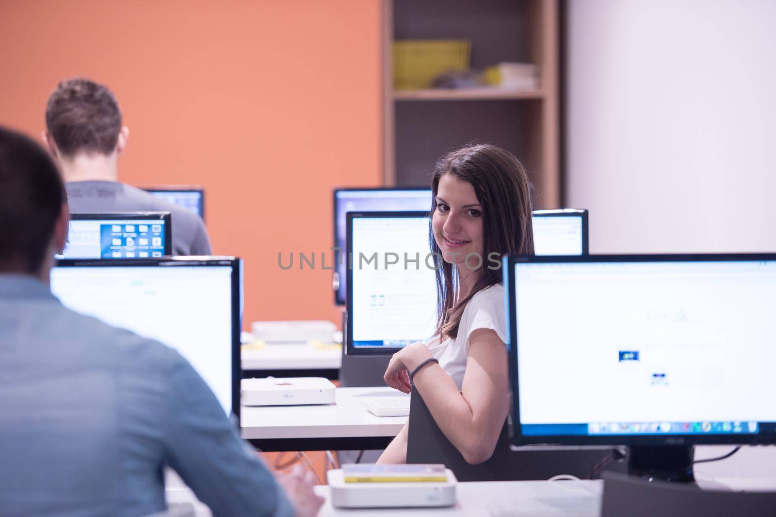 technology students group in computer lab school  classroom by dotshock