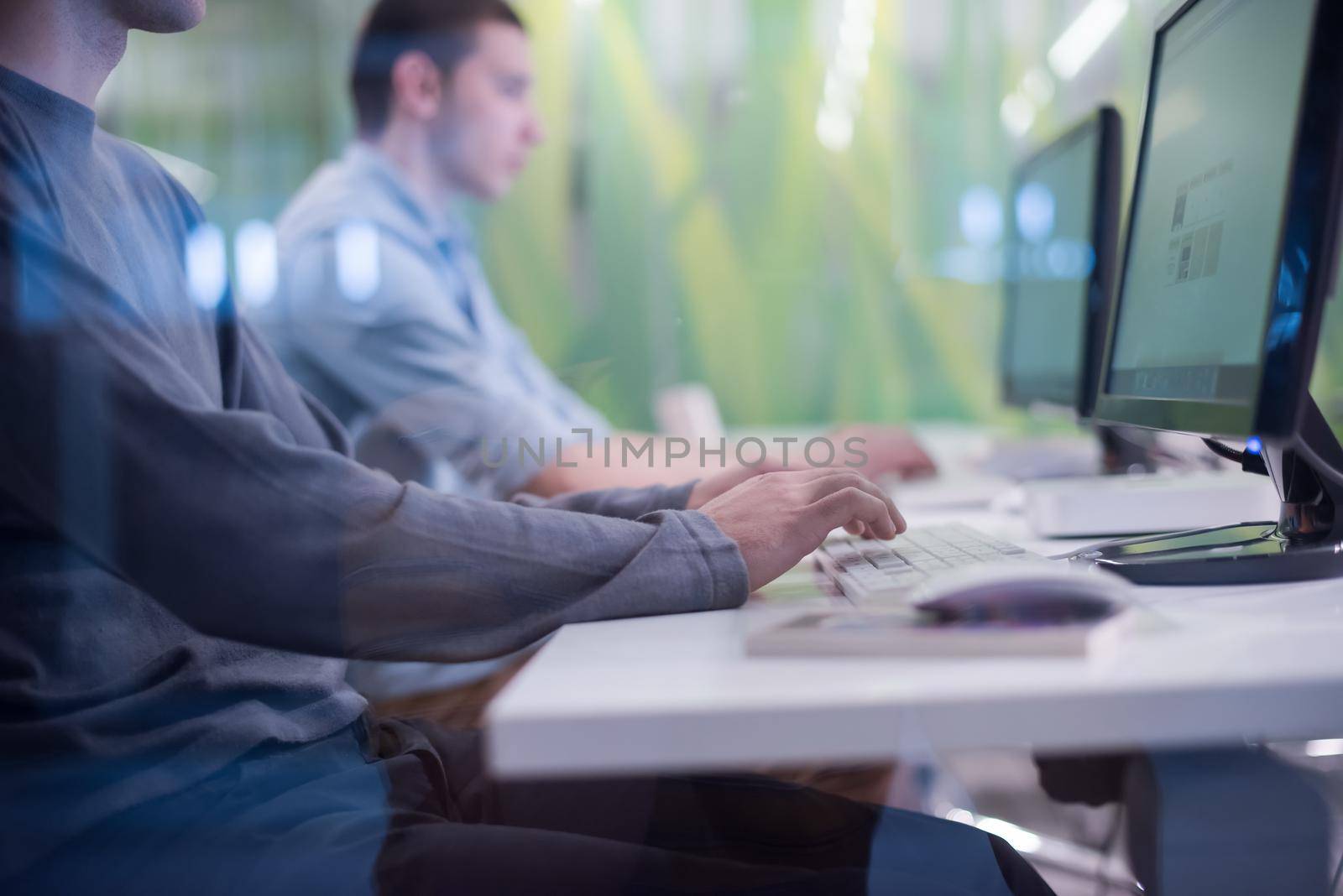 technology students group in computer lab school  classroom working on