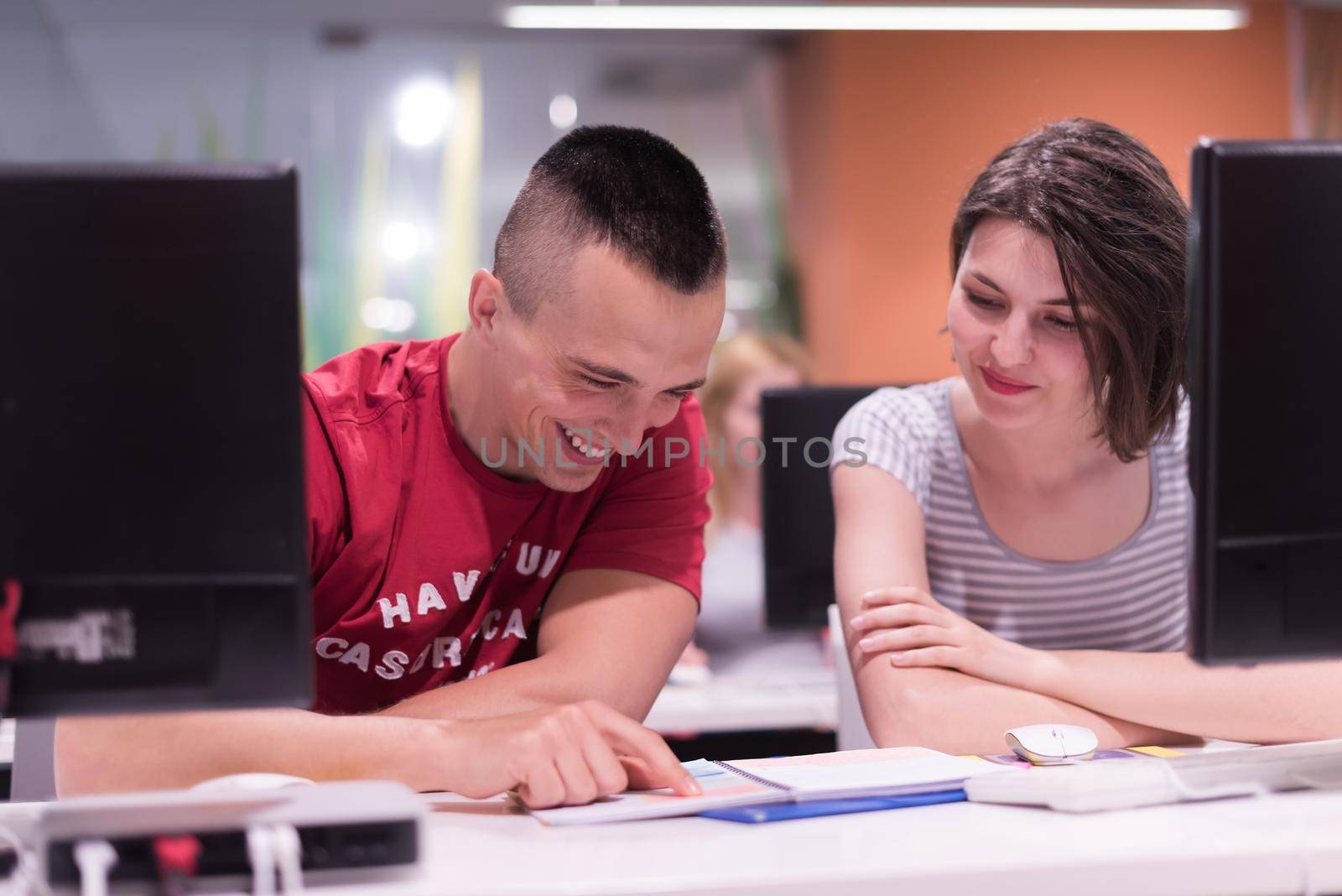 technology students group in computer lab school  classroom working on