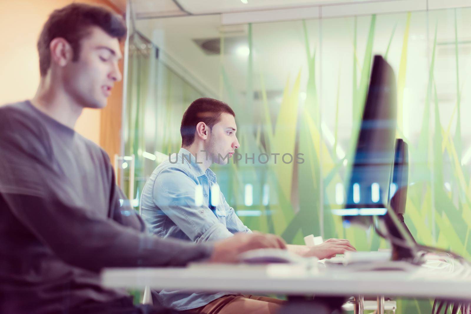 technology students group working  in computer lab school  classroom by dotshock