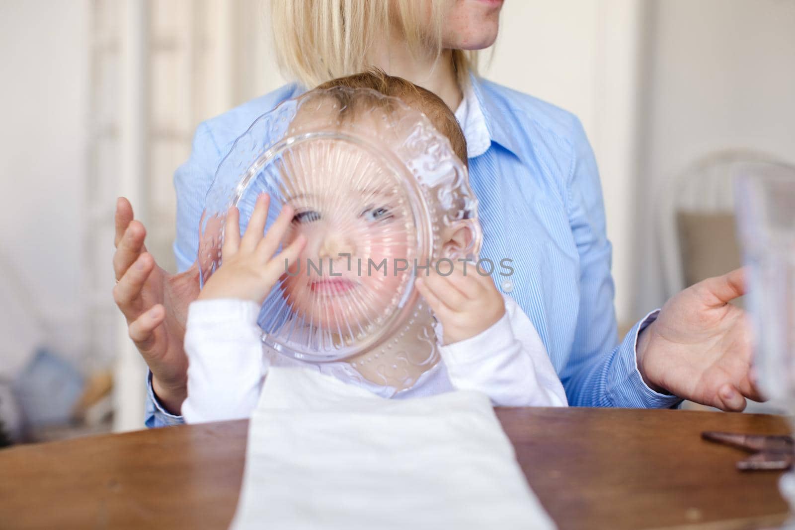 Child looking through glass plate by Demkat