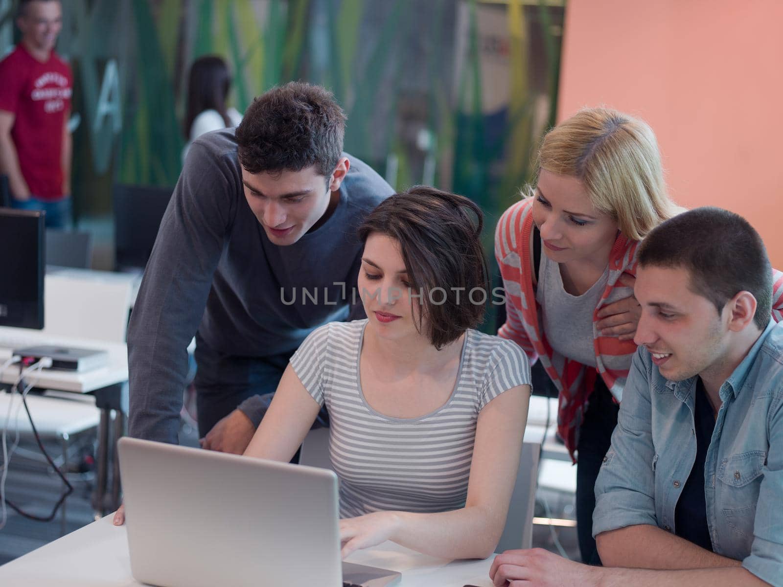 group of students study together in classroom by dotshock