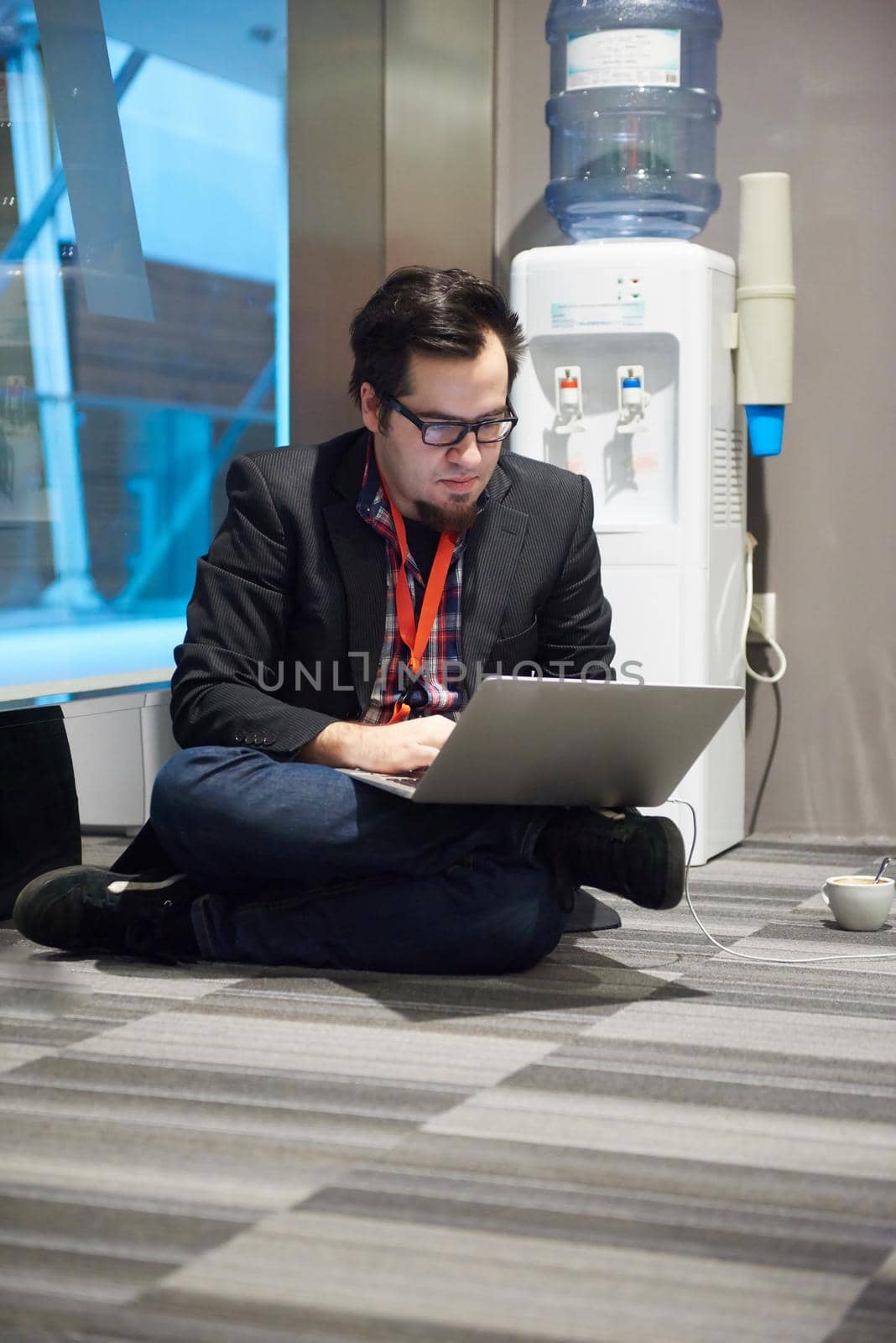 young business man in rush prepare conference presentation on laptop computer in startup company office interior