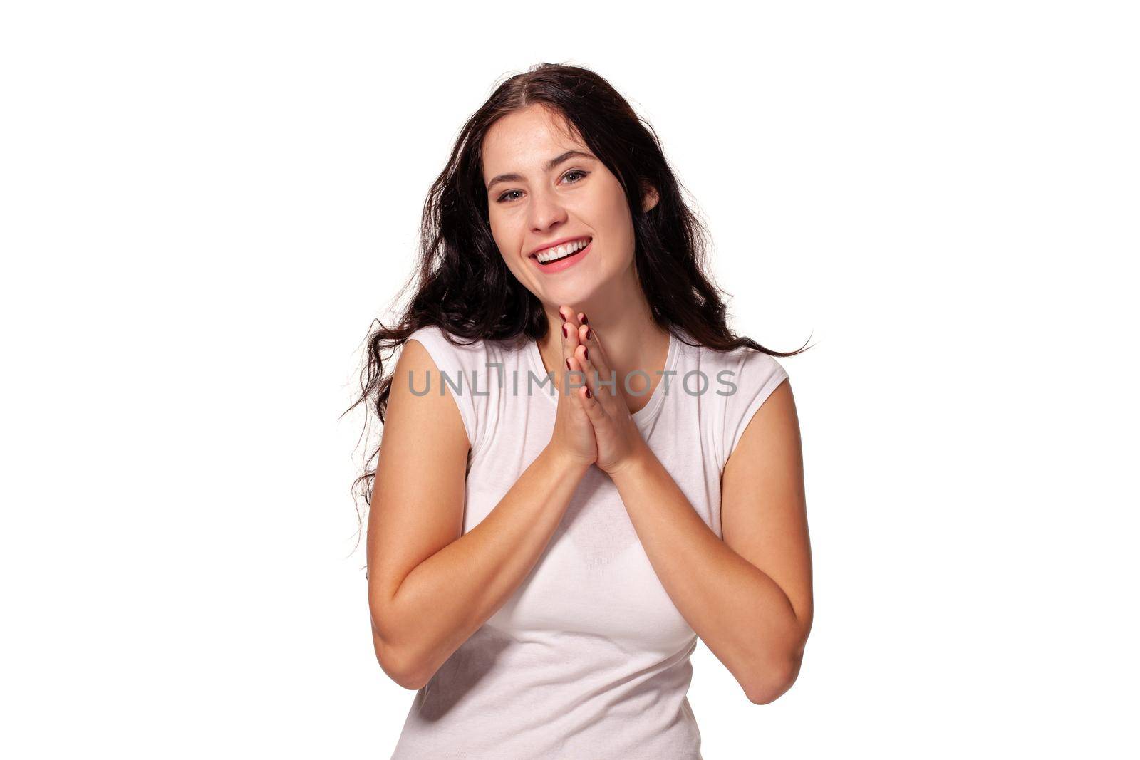 A close up image of a beautiful woman praying with her hands foldedand isolated for white background