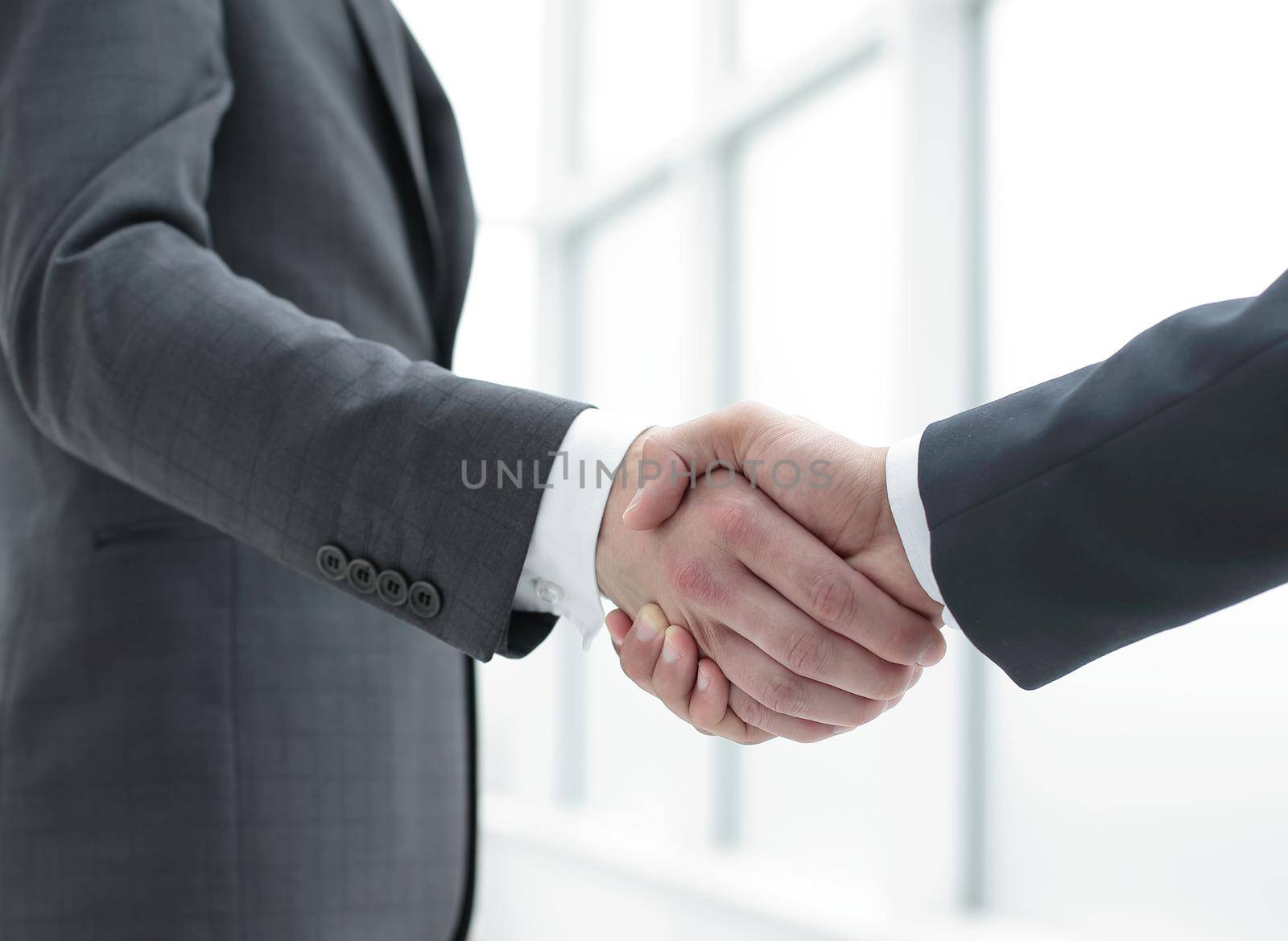 close up.handshake business partners.concept of cooperation