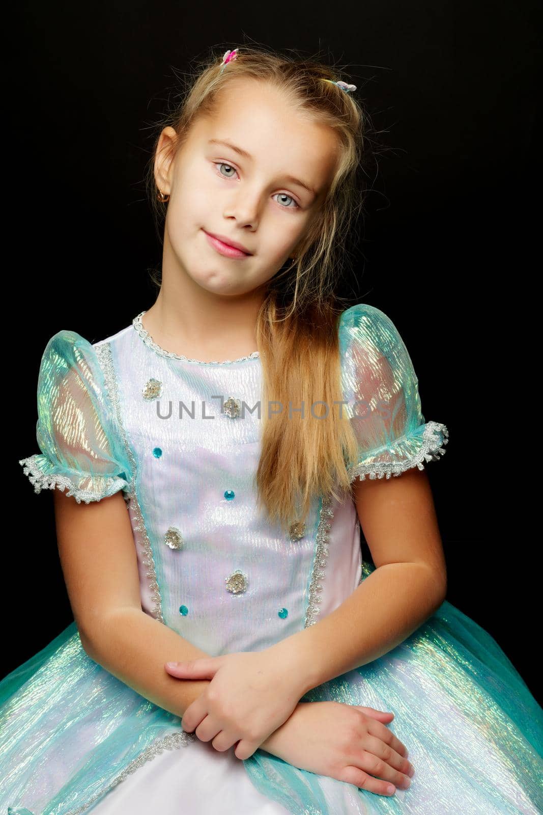 Little little girl studio portrait on a black background. Close- by kolesnikov_studio