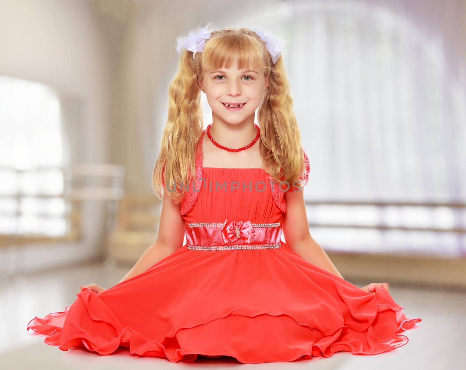 Little girl in orange dress by kolesnikov_studio