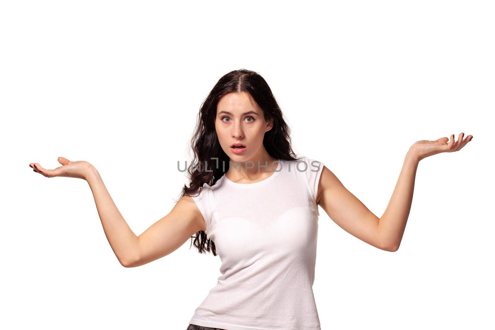 Beautiful, sweet, young girl spreads her arms on the white background