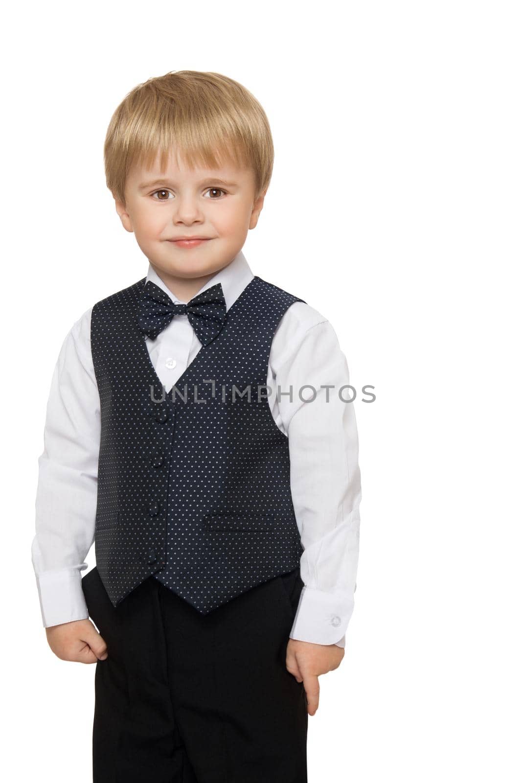Cute little boy in white shirt, vest and bow tie- Isolated on white background