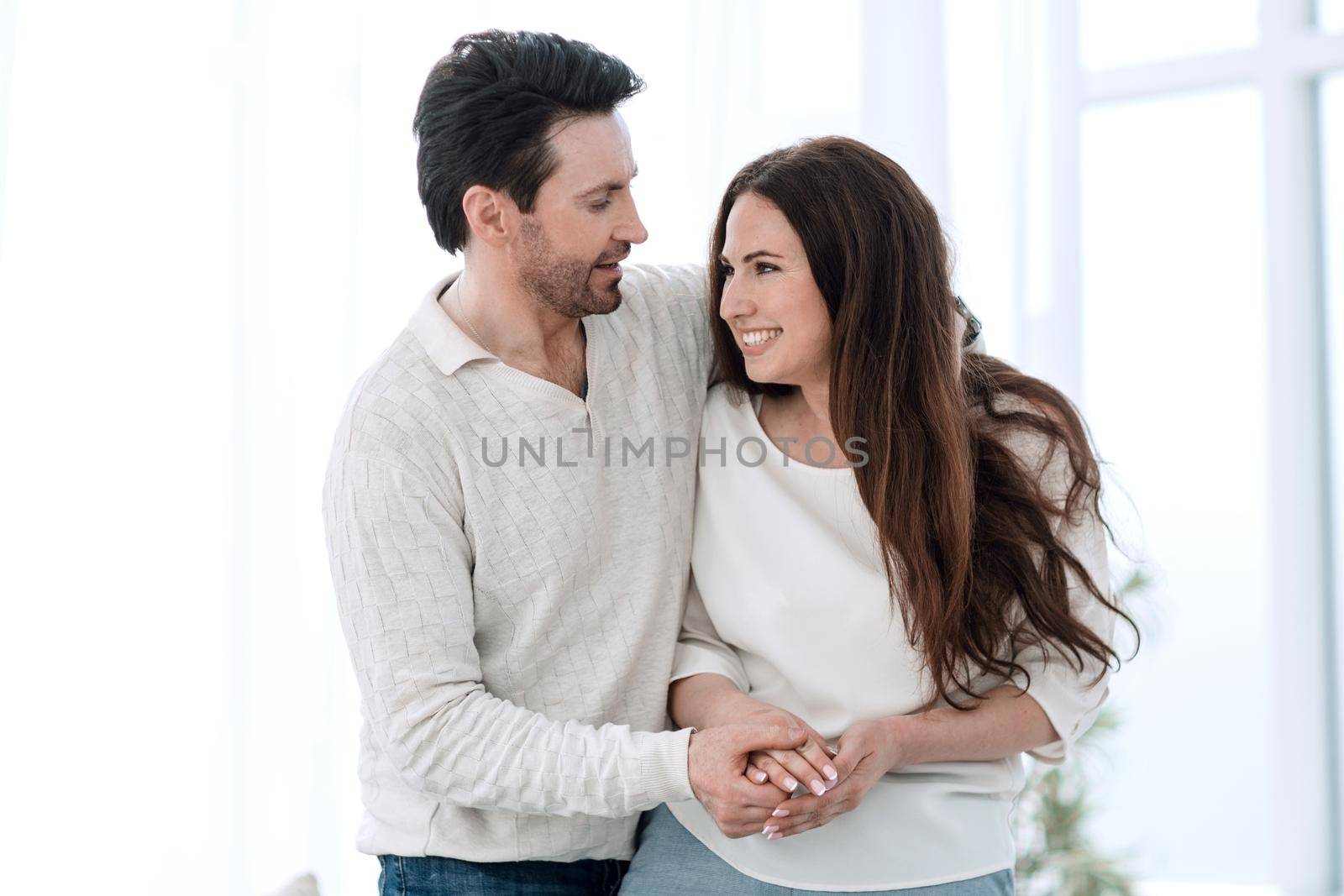 portrait of a couple in love sitting near the window.the concept of the relationship