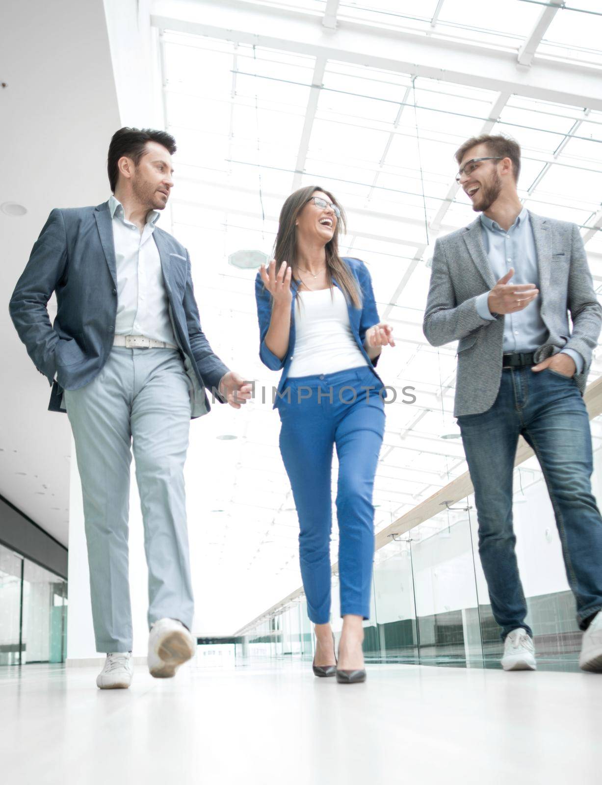 Business people walking in the office corridor.business concept