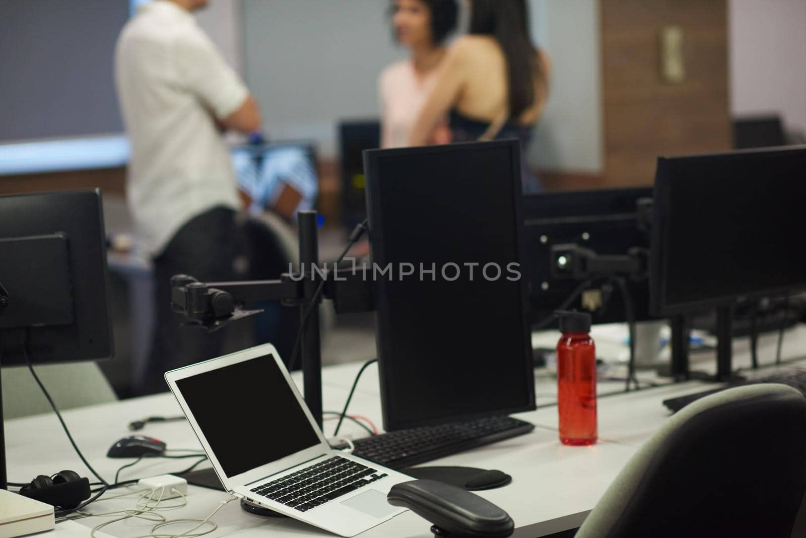 dual monitor screen and laptop computer at modern office indoors, startup company software develop  technology