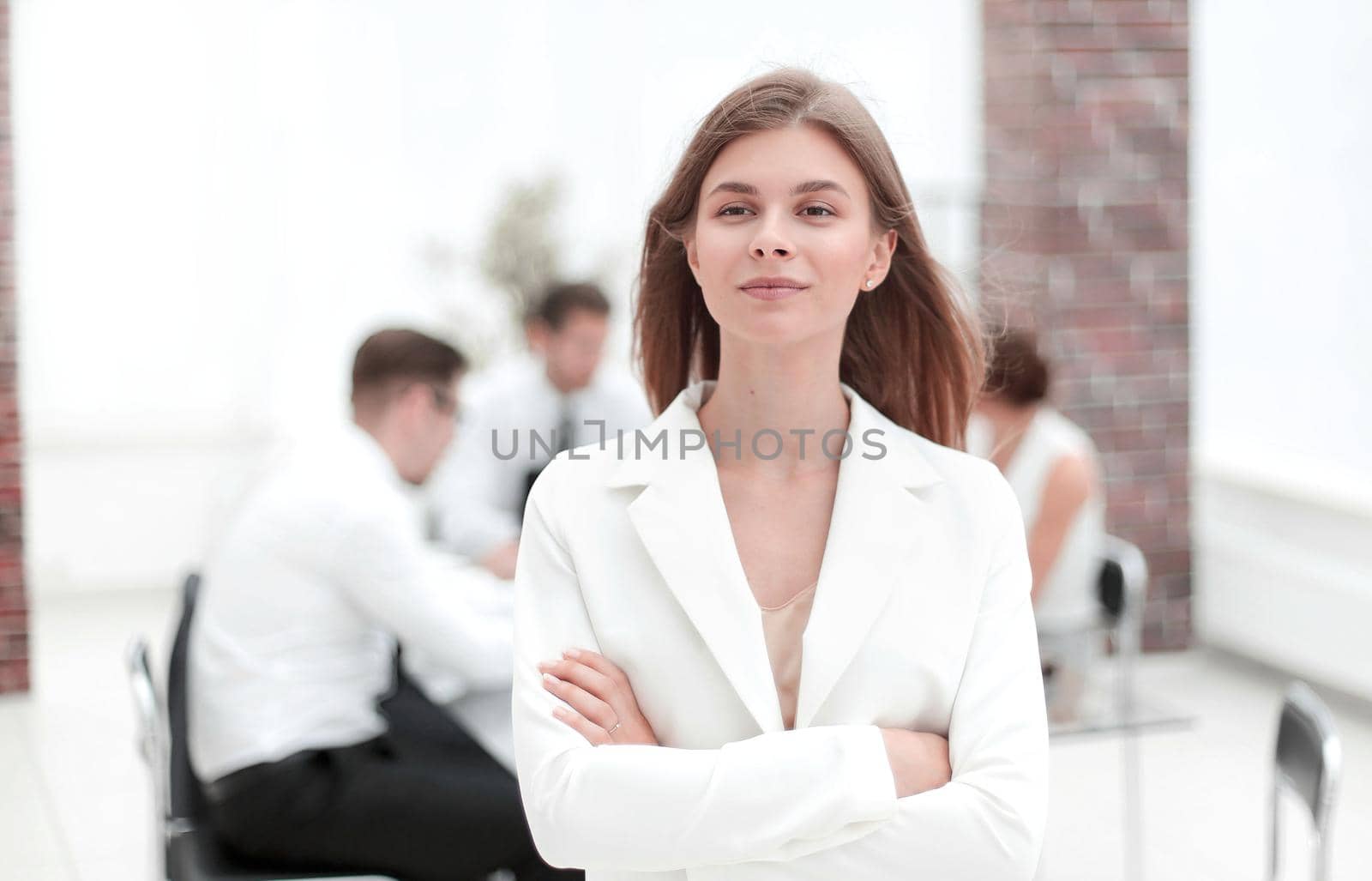 dreams of a young business woman standing in office.photo with copy space