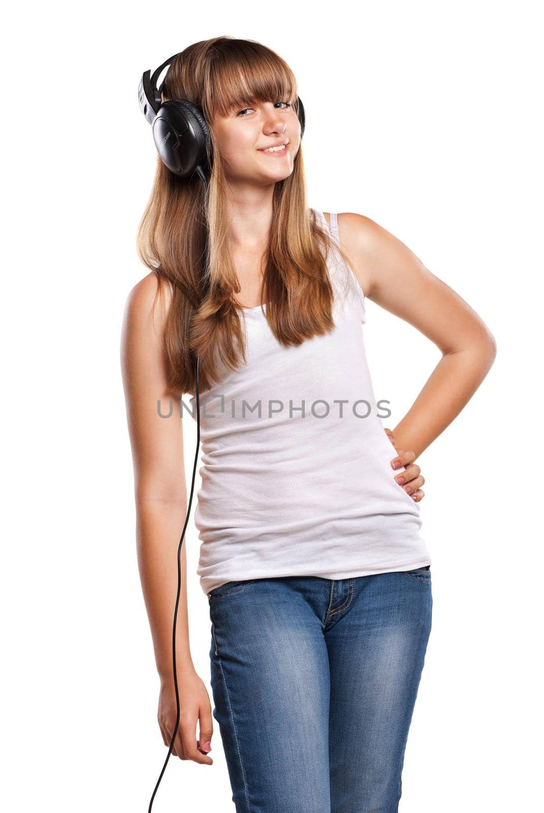 Lovely girl listening a music in headphones by Julenochek