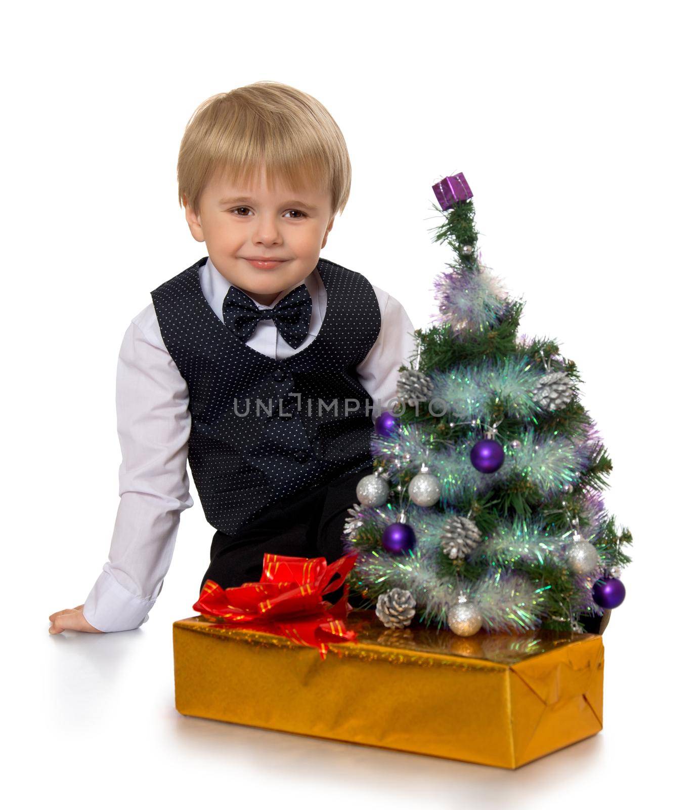 Cute little boy holding a gift - Isolated on white background