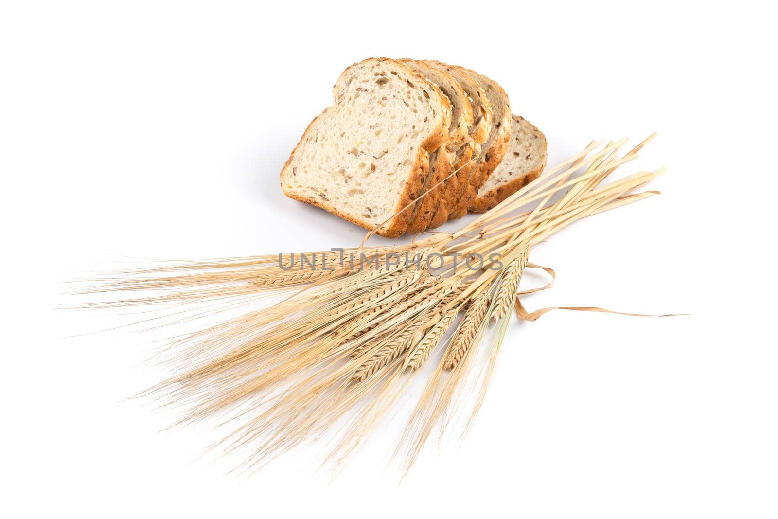 fresh bread and wheat on white by RTsubin