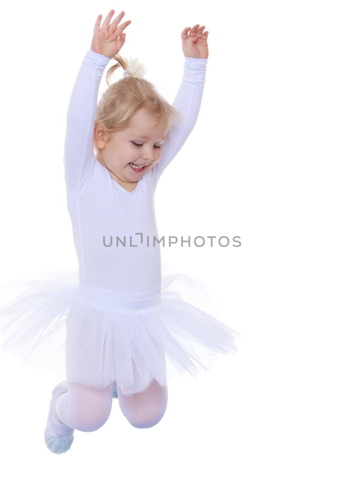 Cheerful little girl is a future gymnast, white sports dress, jumps on the blue track Mat-Isolated on white background