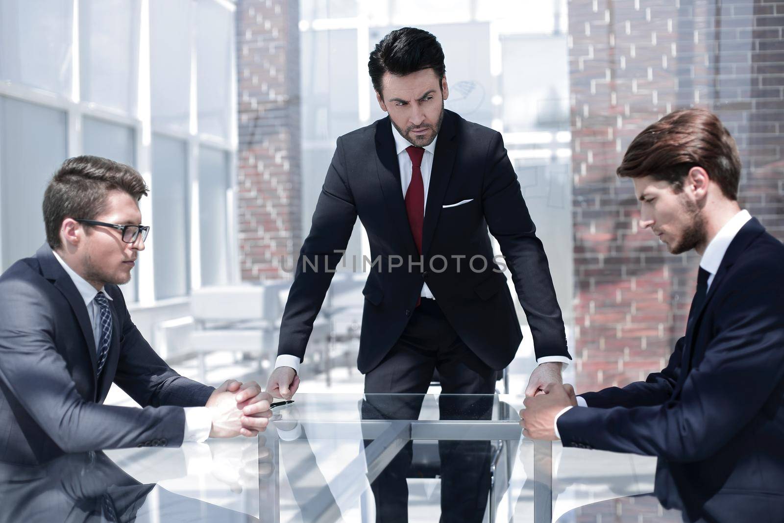 annoyed businessman talking to employees by asdf