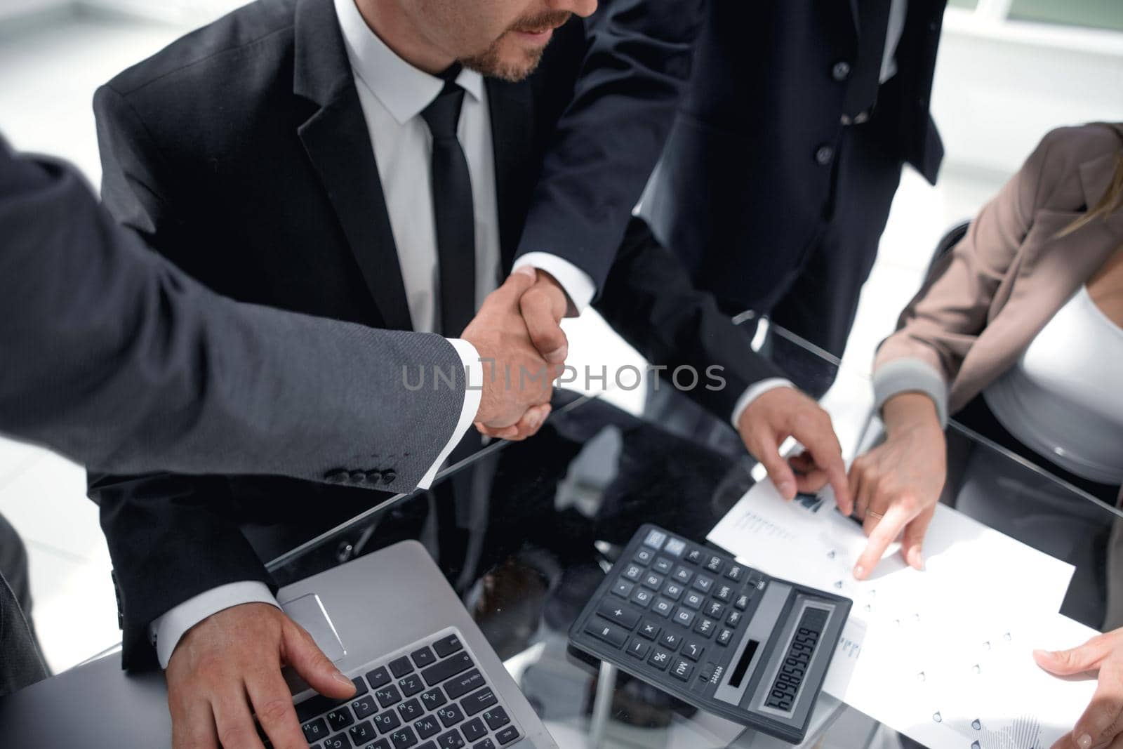 closeup, businessman handshaking after conference.