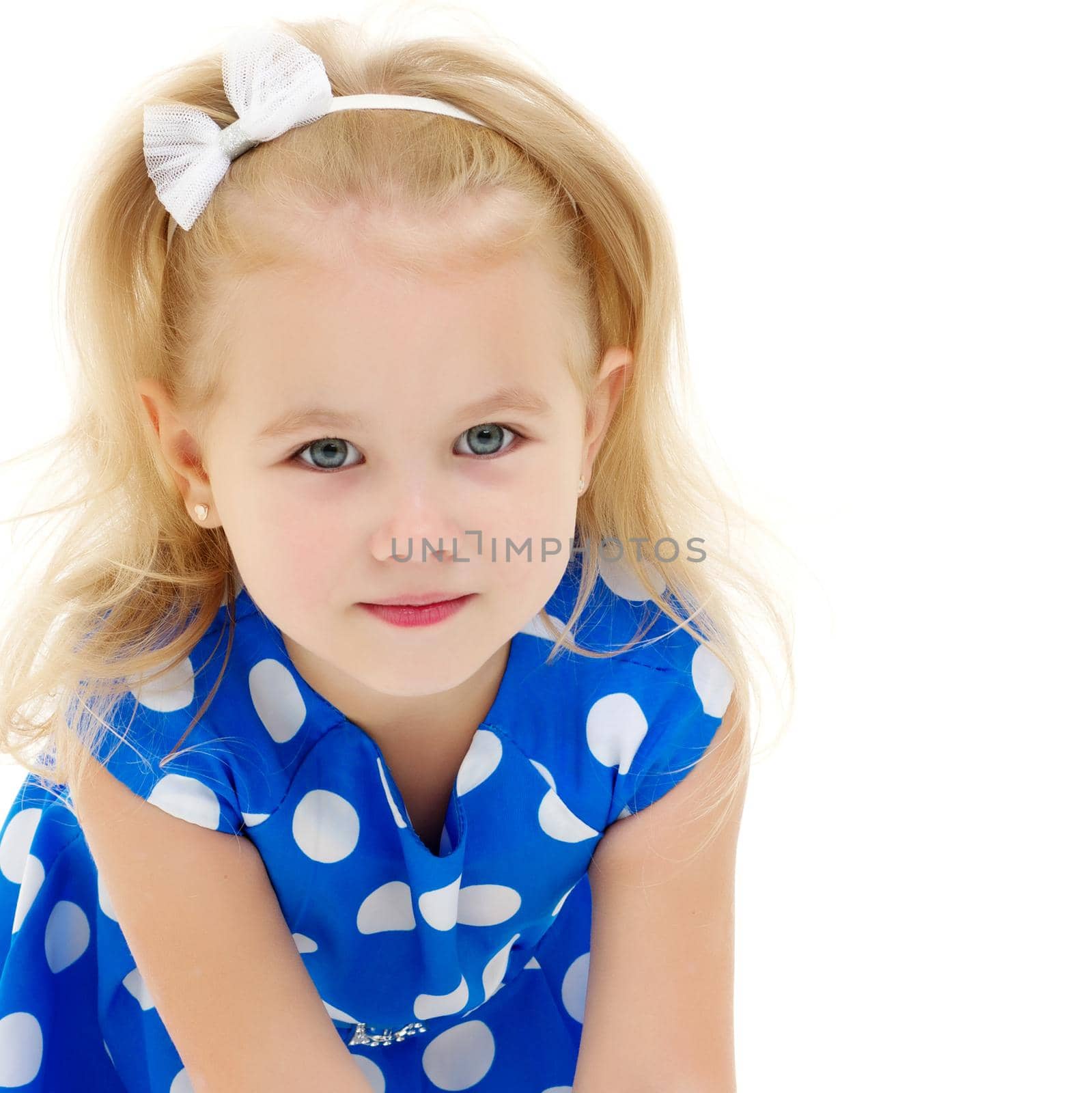 Beautiful little girl close-up. The concept of beauty and fashion, happy childhood. Isolated on white background.