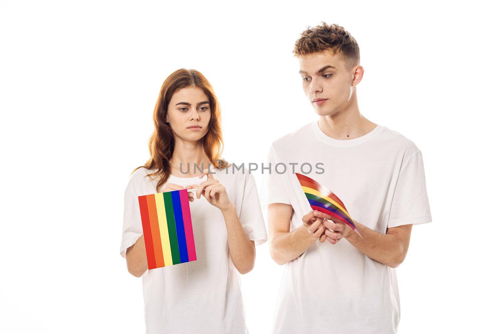 young couple lgbt Flag transgender community light background. High quality photo