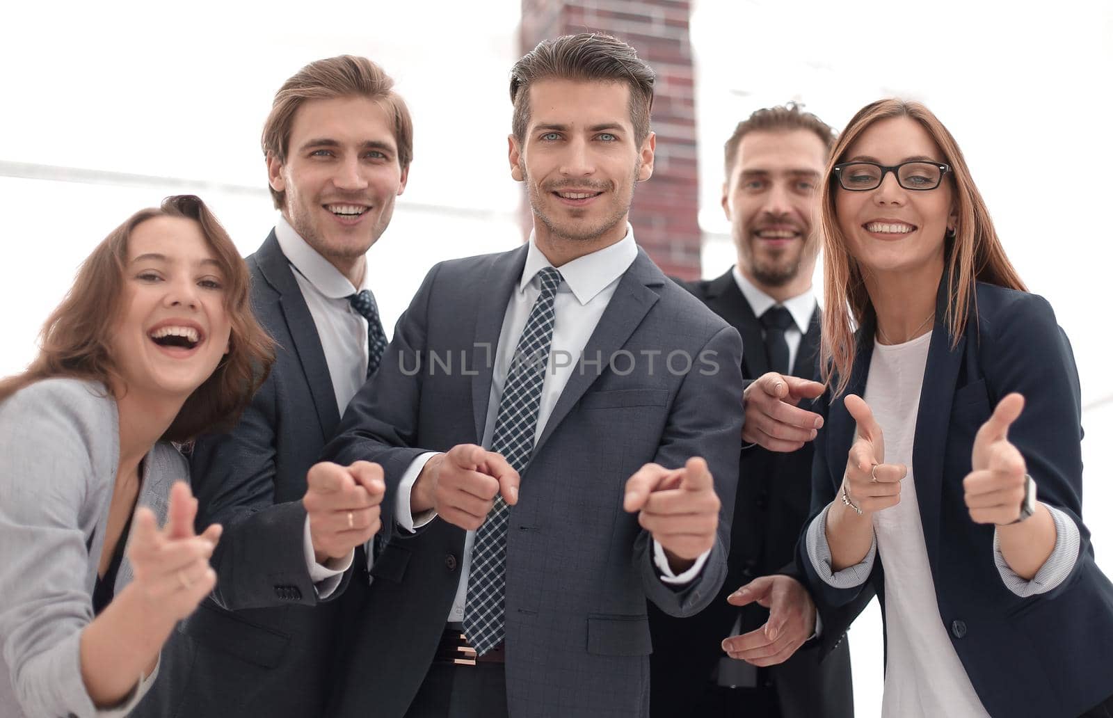 cheerful business people stand next to each other
