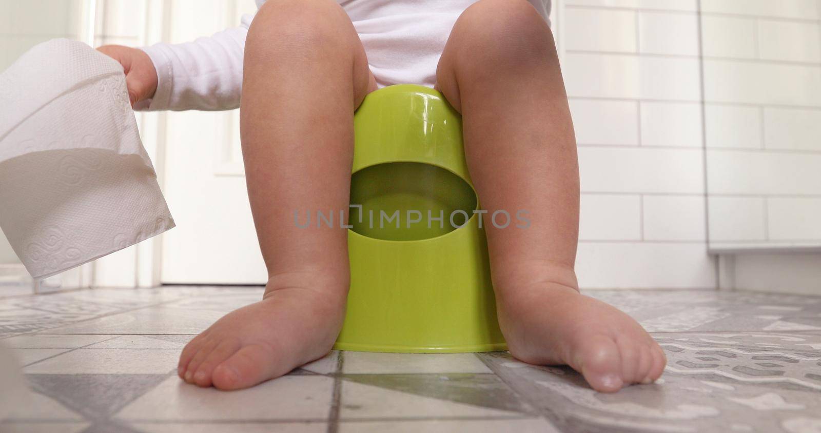 Baby sitting chamberpot his legs hanging down pot by Demkat