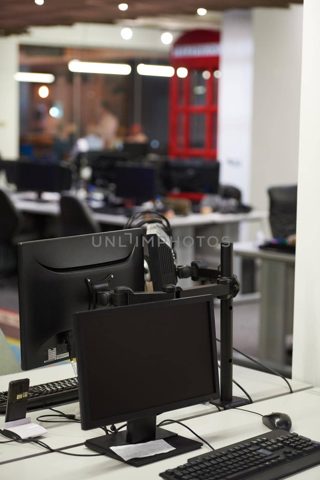 dual monitor screen and laptop computer at modern office indoors, startup company software develop  technology