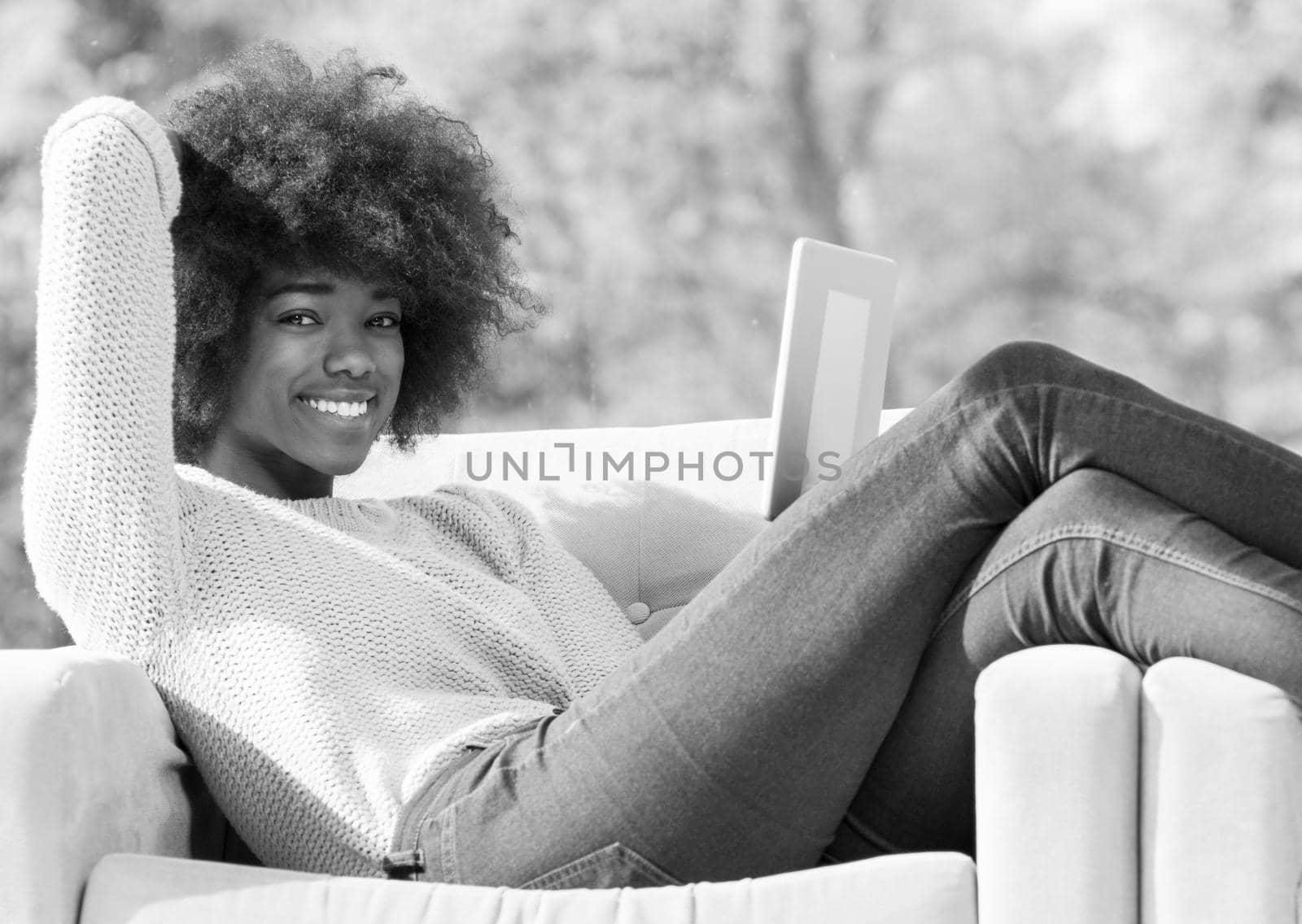 Beautifl black girl lying on couch by dotshock