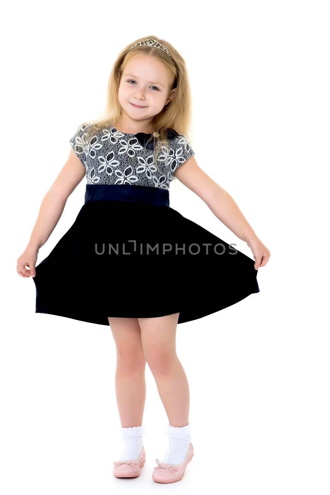 Little girl in a dress developing in the wind. by kolesnikov_studio