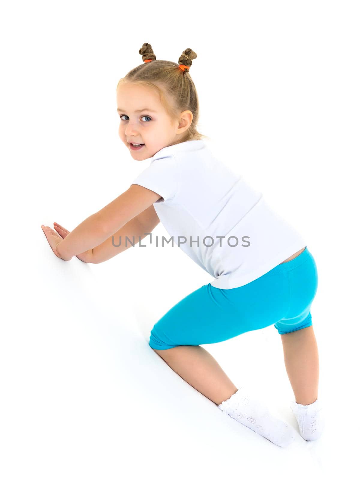Cute little girl playing on the floor. The concept of education, relationships, family. Isolated on white background.