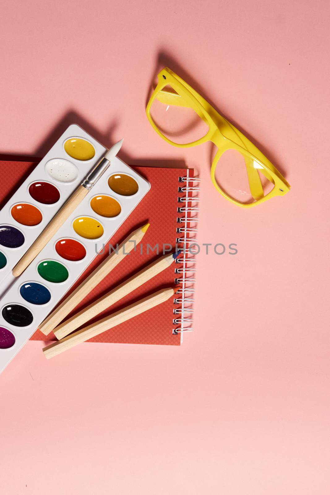 acrylic paints paint brushes art items abstract paper view from above. High quality photo