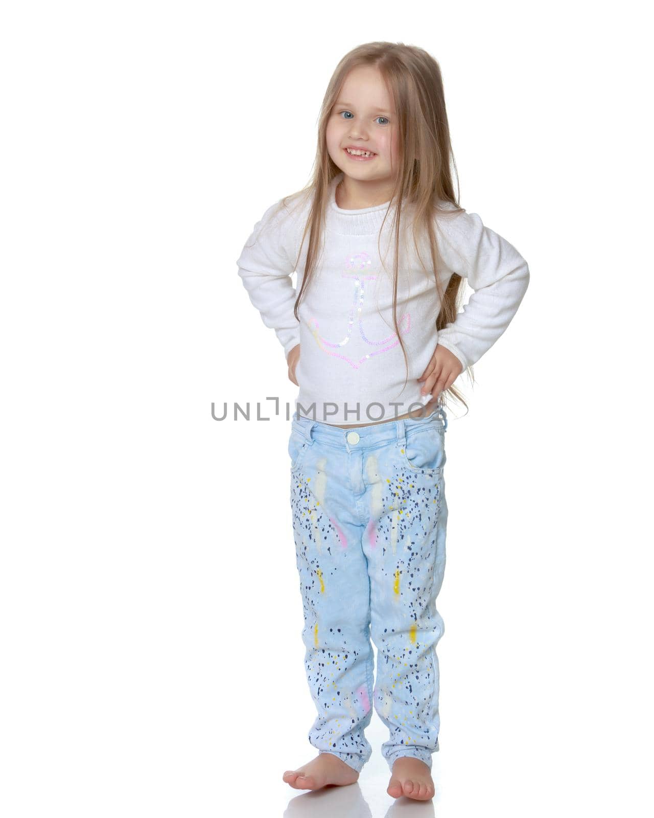 Studio portrait of a beautiful little girl. The concept of fashion, family happiness, harmonious development of the child. Isolated on white background.