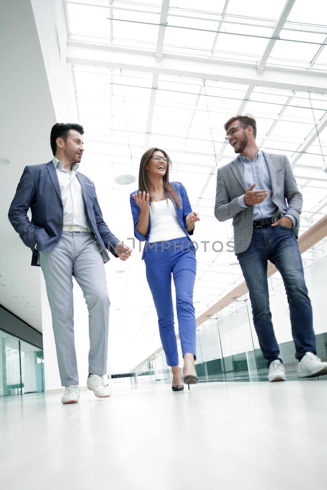 Business people walking in the office corridor.business concept