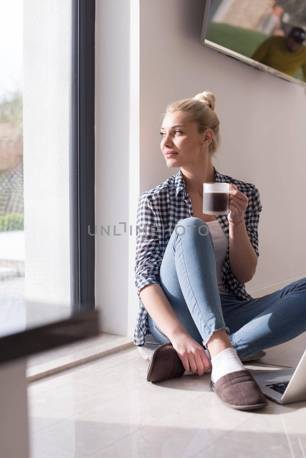 Real Woman Using laptop At Home on the floor Drinking Coffee Enjoying Relaxing