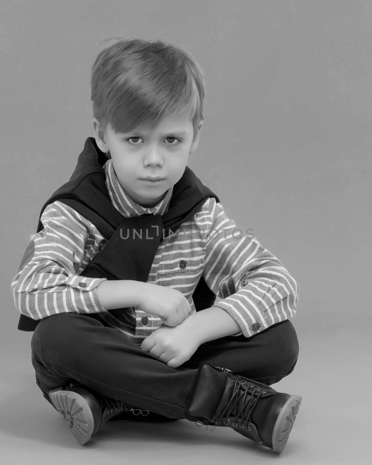 The little boy frowned. by kolesnikov_studio