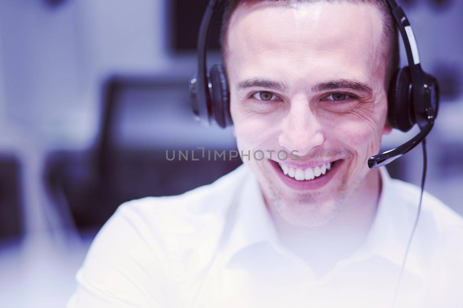 male call centre operator doing his job by dotshock