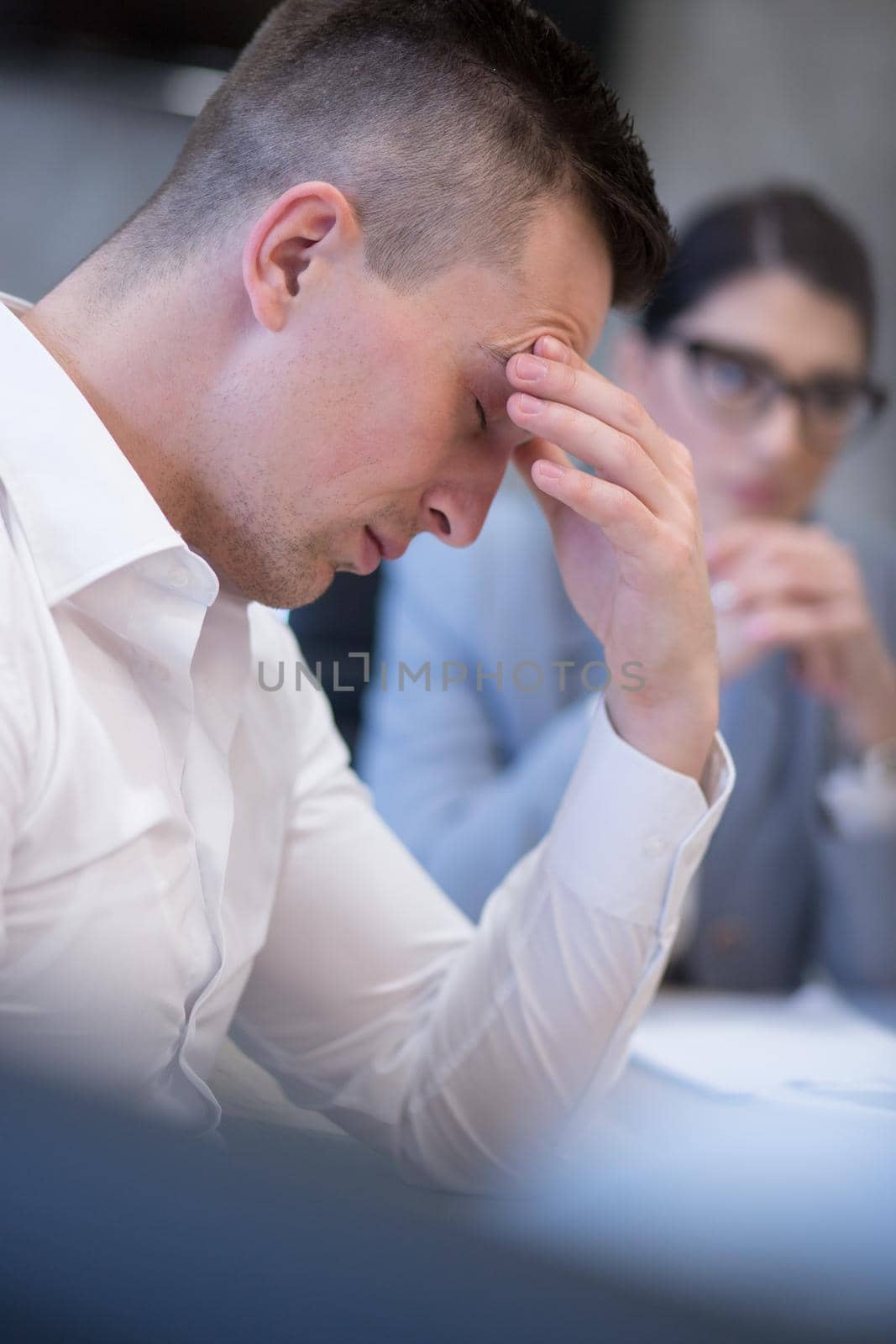 young businessman relaxing at the desk by dotshock