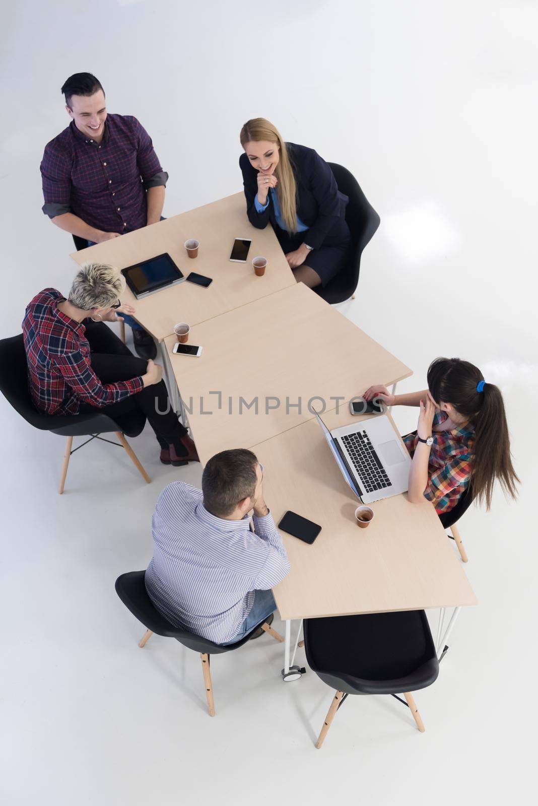 top view of multi ethnic startup business people group on brainstorming meeting in modern bright office interior