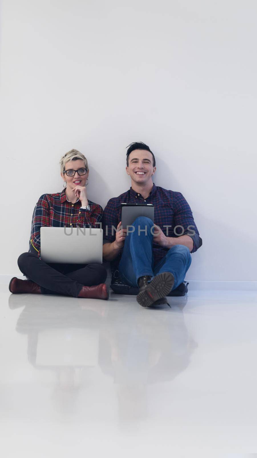 startup business, couple working on laptop computer at office by dotshock