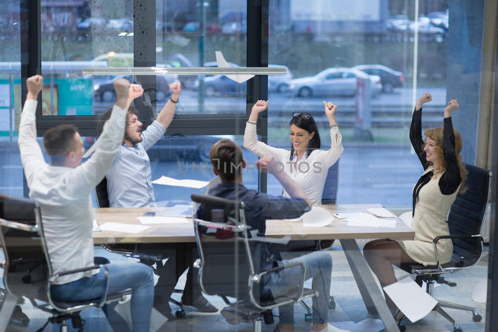 startup Group of young business people throwing documents by dotshock