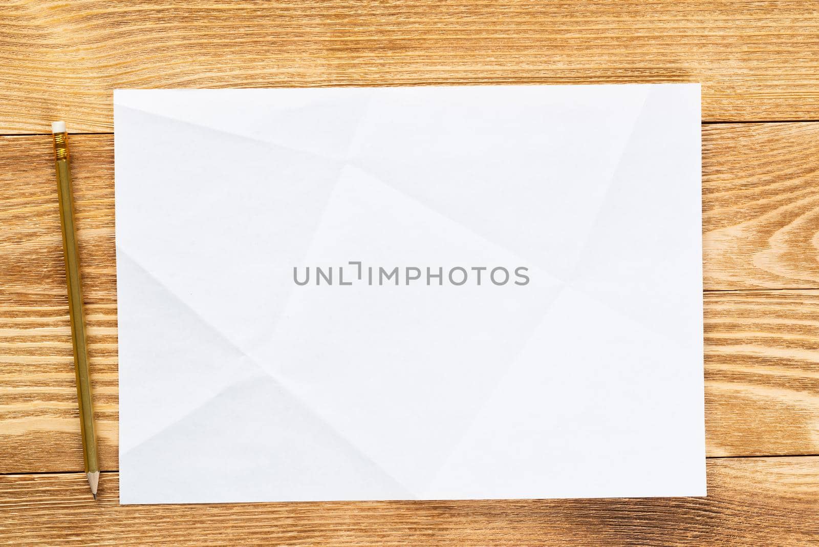 Sheet of paper lying on wooden table by adam121